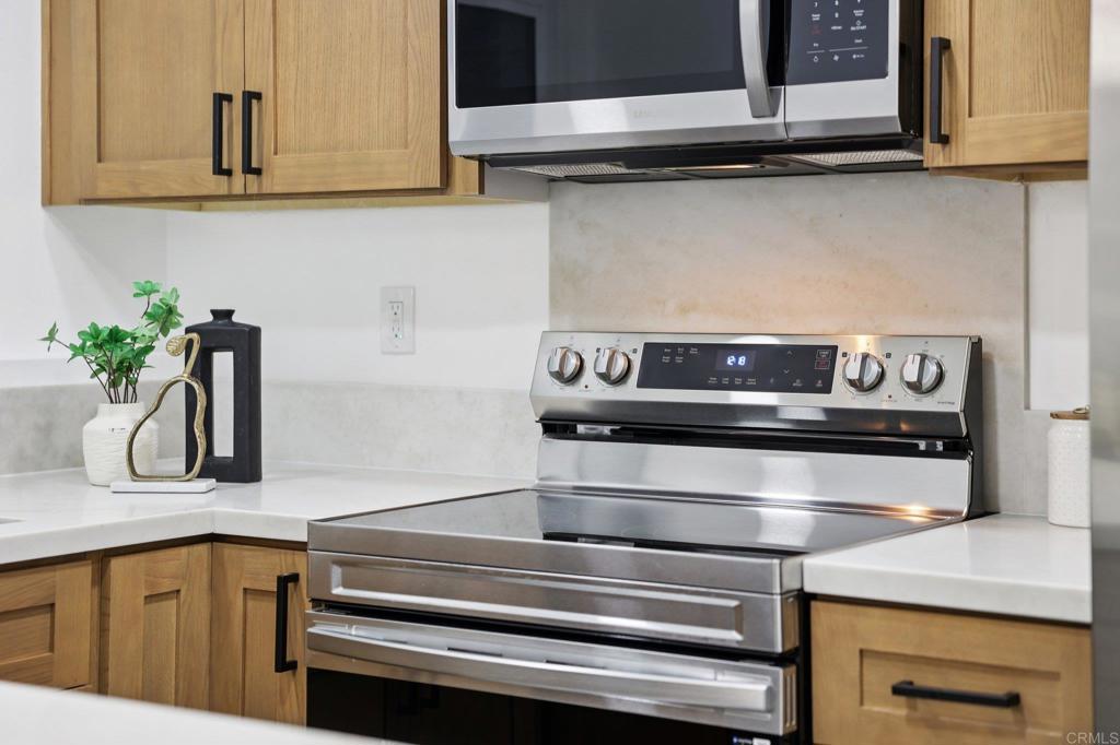 2600 Torrey Pines Road, Unit A13 La Jolla, CA 92037 - Photo 25 of 65 a kitchen with a microwave and cabinets