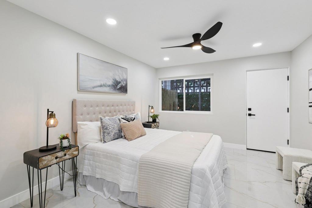 2600 Torrey Pines Road, Unit A13 La Jolla, CA 92037 - Photo 26 of 65 a bedroom with a bed and a painting on the wall