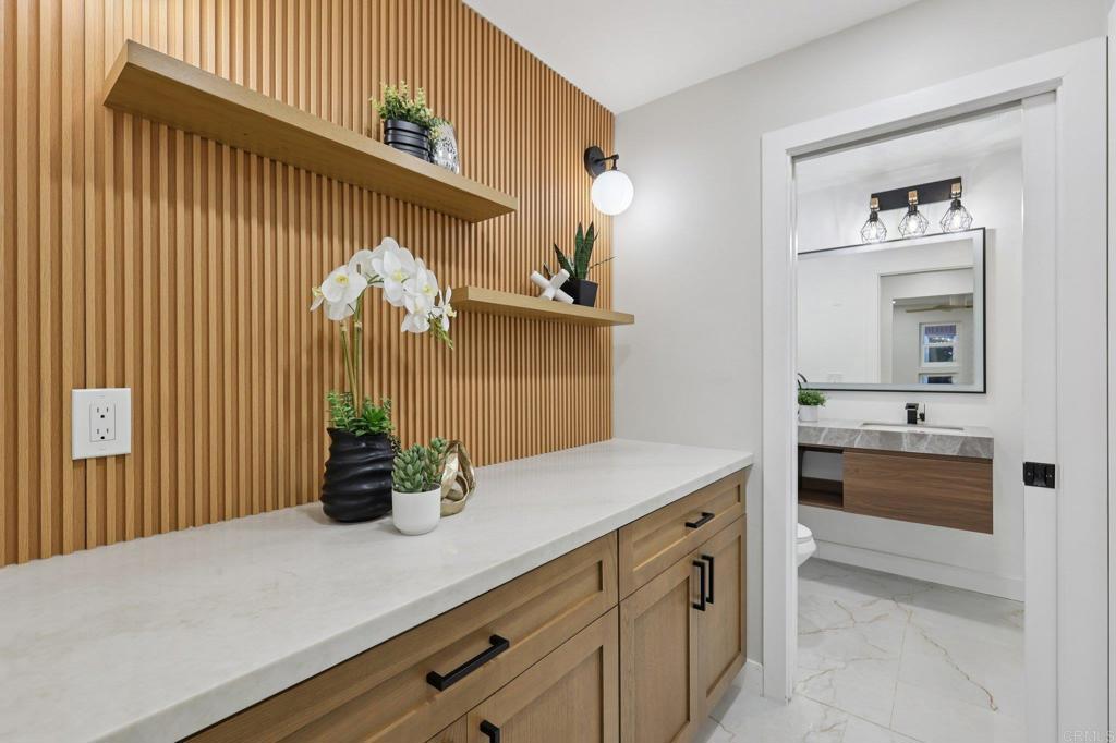 2600 Torrey Pines Road, Unit A13 La Jolla, CA 92037 - Photo 27 of 65 a kitchen with a sink and cabinets