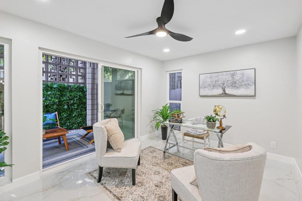 2600 Torrey Pines Road, Unit A13 La Jolla, CA 92037 - Photo 28 of 65 a living room with furniture and a large window