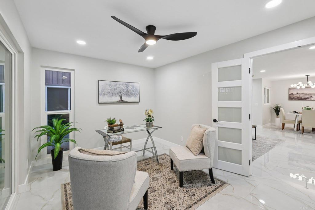 2600 Torrey Pines Road, Unit A13 La Jolla, CA 92037 - Photo 31 of 65 a living room with furniture and a potted plant