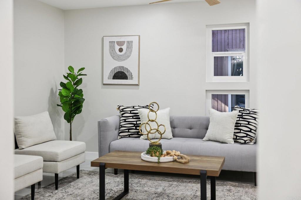 2600 Torrey Pines Road, Unit A13 La Jolla, CA 92037 - Photo 35 of 65 a living room with furniture and a potted plant