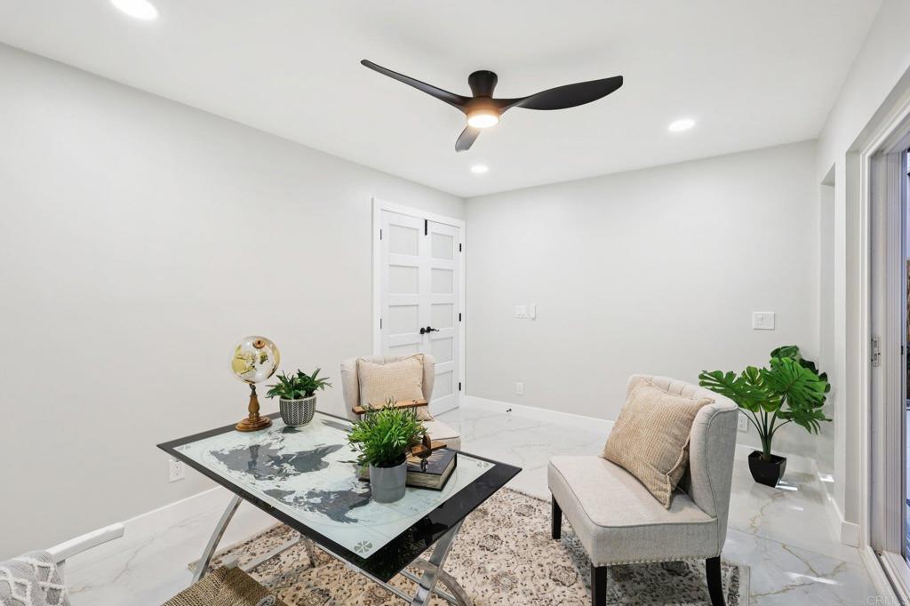 2600 Torrey Pines Road, Unit A13 La Jolla, CA 92037 - Photo 40 of 65 a living room with furniture and a potted plant