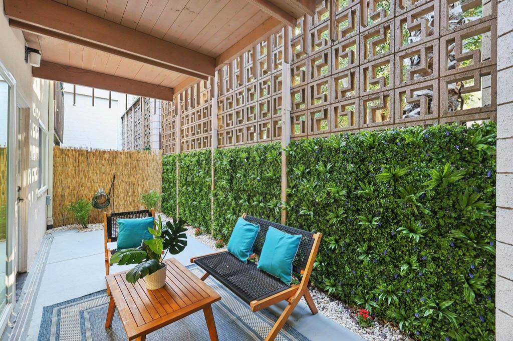 2600 Torrey Pines Road, Unit A13 La Jolla, CA 92037 - Photo 46 of 65 a view of a patio with couches table and chairs and potted plants