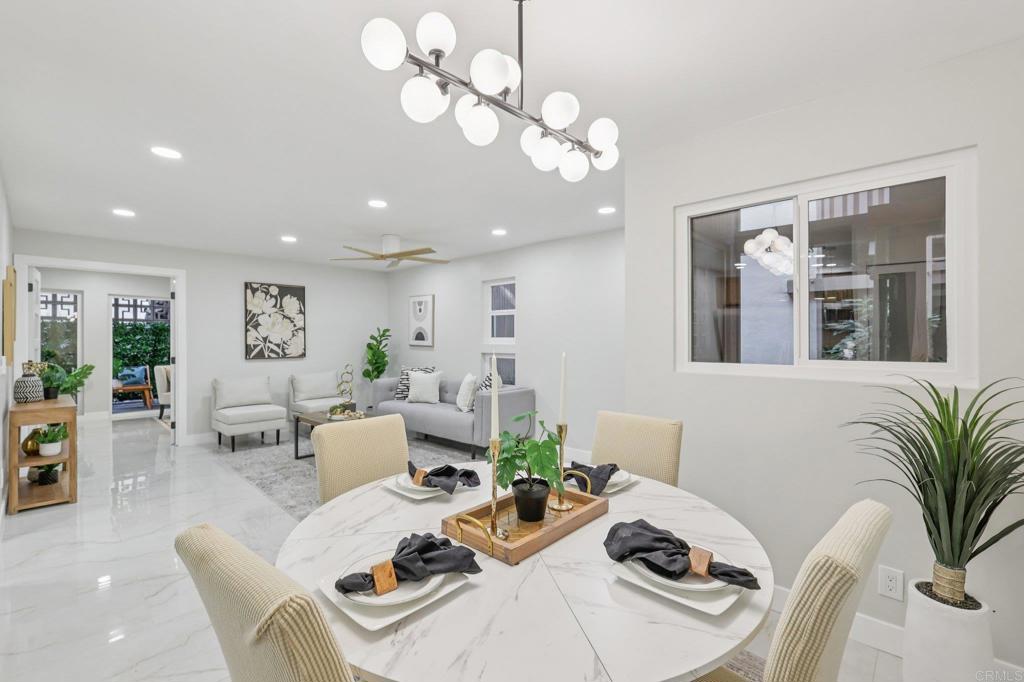 2600 Torrey Pines Road, Unit A13 La Jolla, CA 92037 - Photo 6 of 65 a living room with furniture chandelier and view of kitchen
