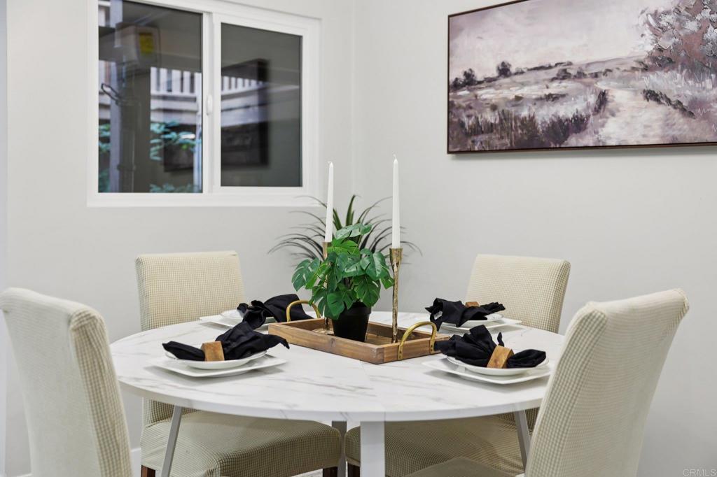 2600 Torrey Pines Road, Unit A13 La Jolla, CA 92037 - Photo 10 of 65 a dining room with furniture and potted plant