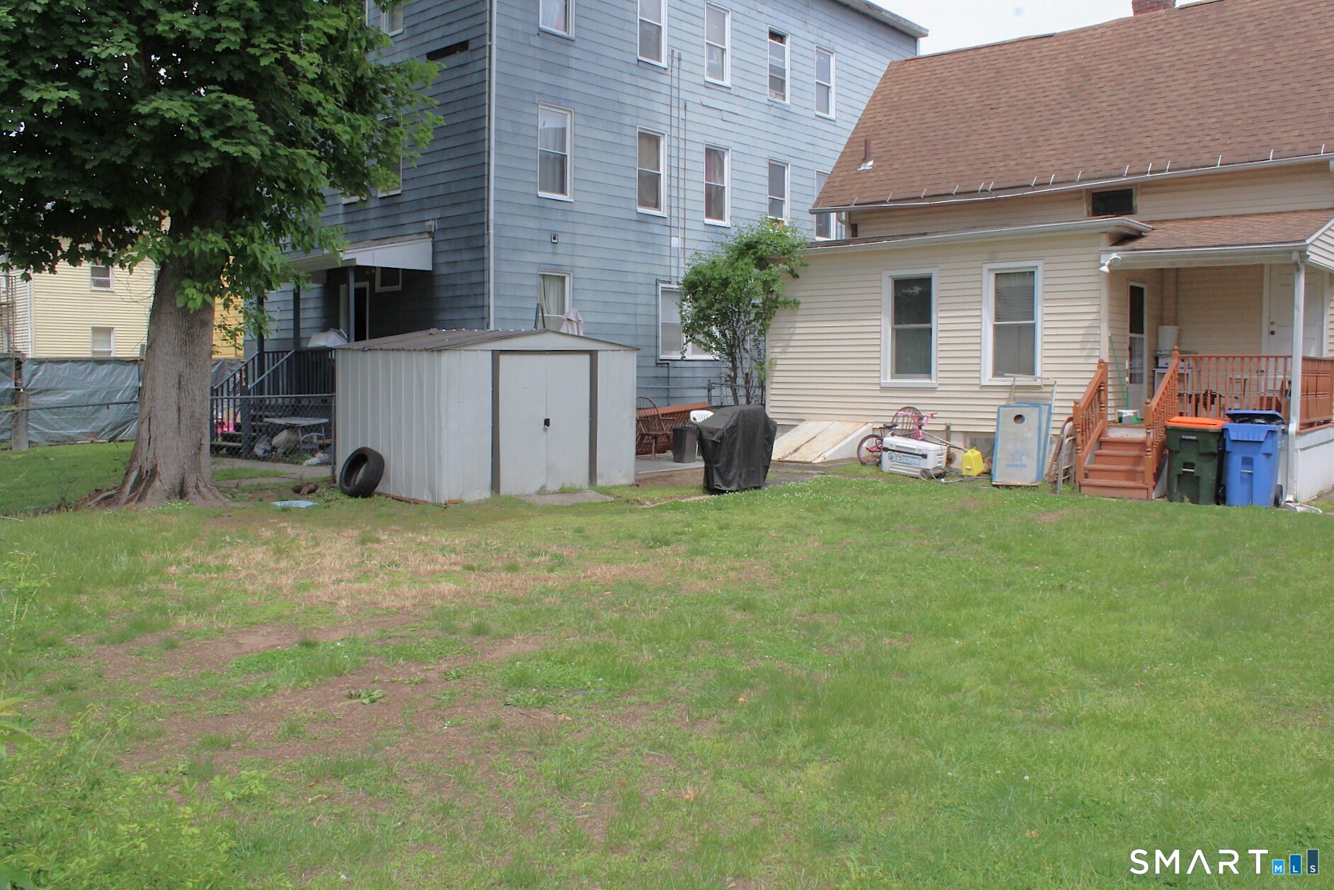 90 Franklin Street Meriden, CT 06450 - Photo 17 of 40 a view of a house with backyard and sitting area