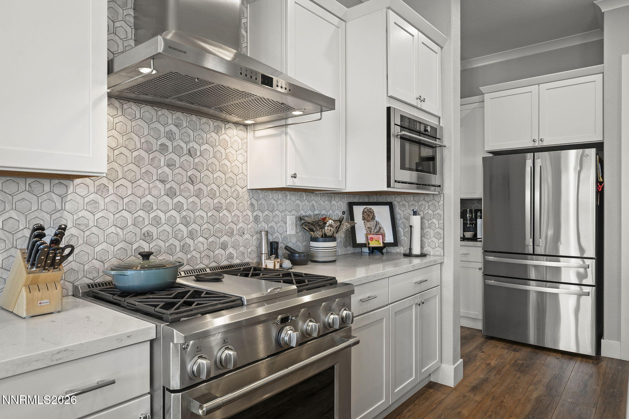 8726 Larkhaven Court Reno, NV 89523 - Photo 12 of 41 a kitchen with stainless steel appliances granite countertop a stove a refrigerator and a granite counter tops
