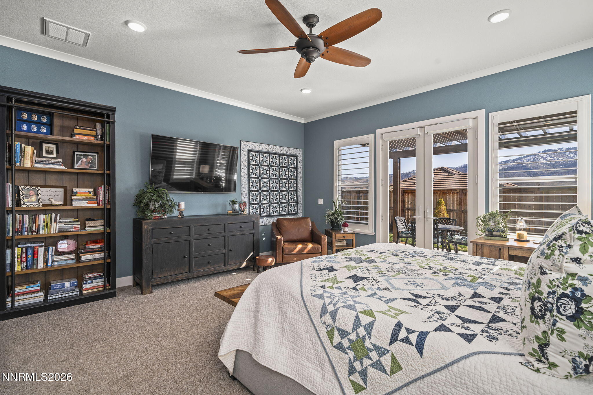 8726 Larkhaven Court Reno, NV 89523 - Photo 16 of 41 a bedroom with a bed furniture and a flat screen tv