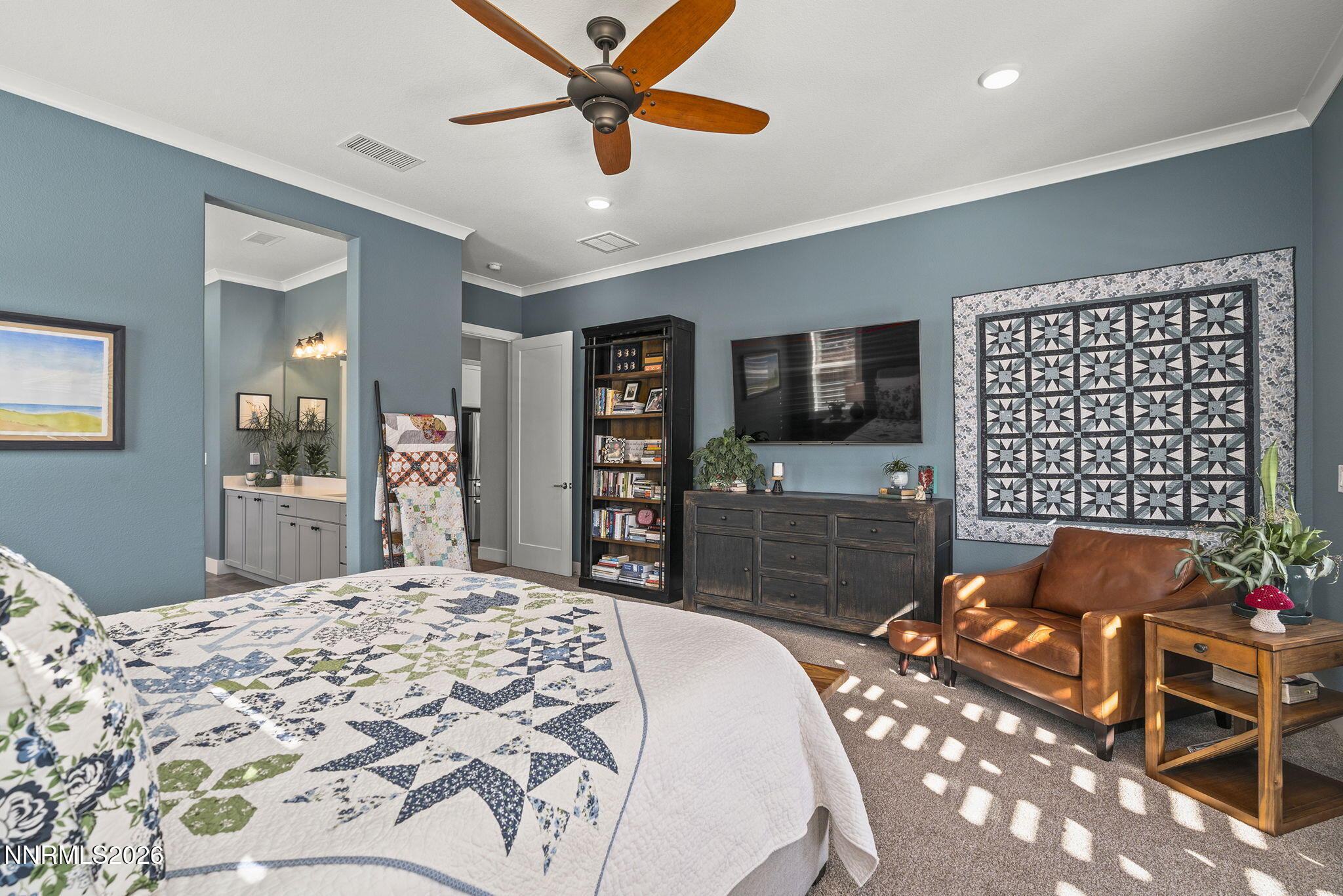 8726 Larkhaven Court Reno, NV 89523 - Photo 17 of 41 a bedroom with furniture and a flat screen tv