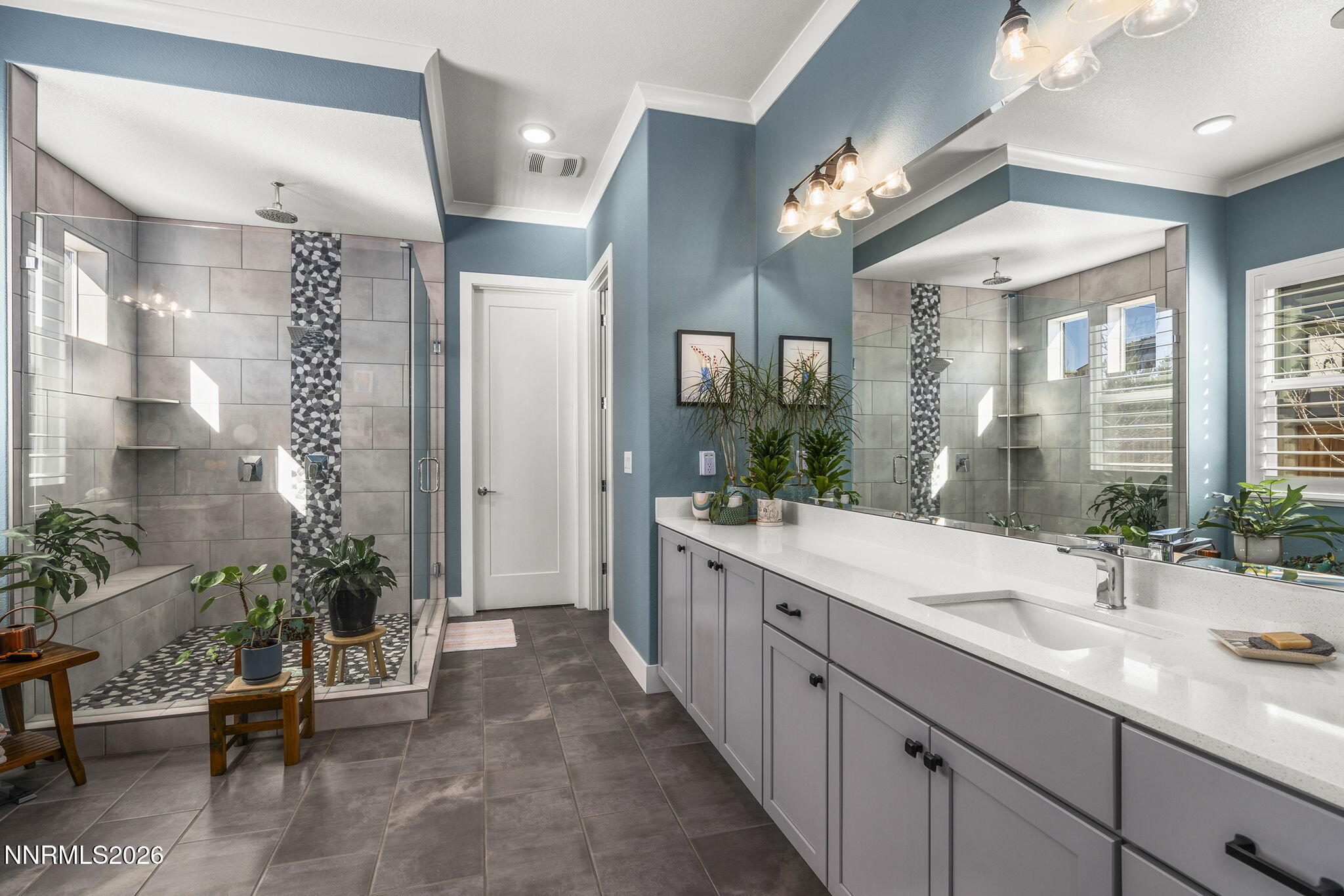 8726 Larkhaven Court Reno, NV 89523 - Photo 18 of 41 a spacious en suite bathroom with a double vanity sink a large mirror and a shower