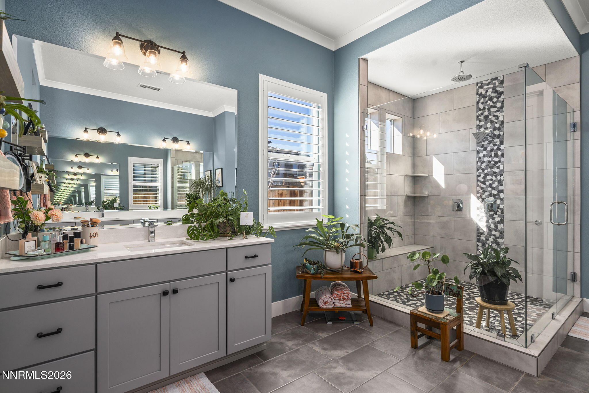 8726 Larkhaven Court Reno, NV 89523 - Photo 19 of 41 a spacious bathroom with a double vanity sink and a mirror