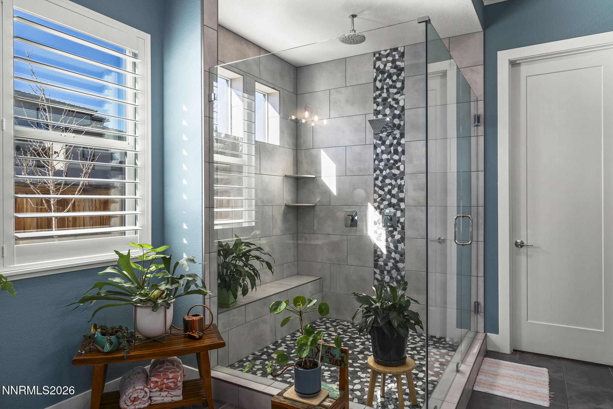 8726 Larkhaven Court Reno, NV 89523 - Photo 20 of 41 a potted plant sitting in front of a door