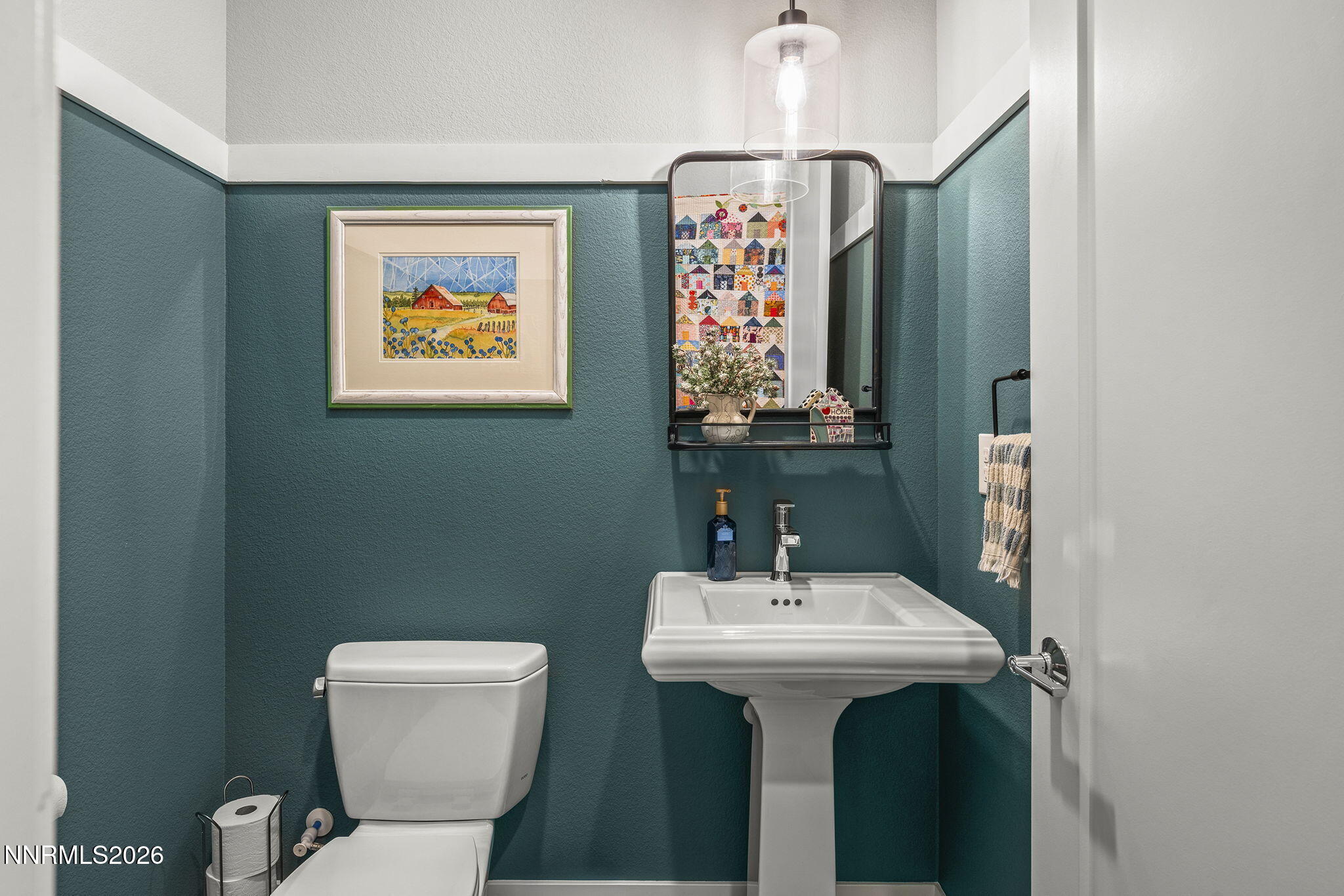 8726 Larkhaven Court Reno, NV 89523 - Photo 26 of 41 a bathroom with a toilet sink and mirror