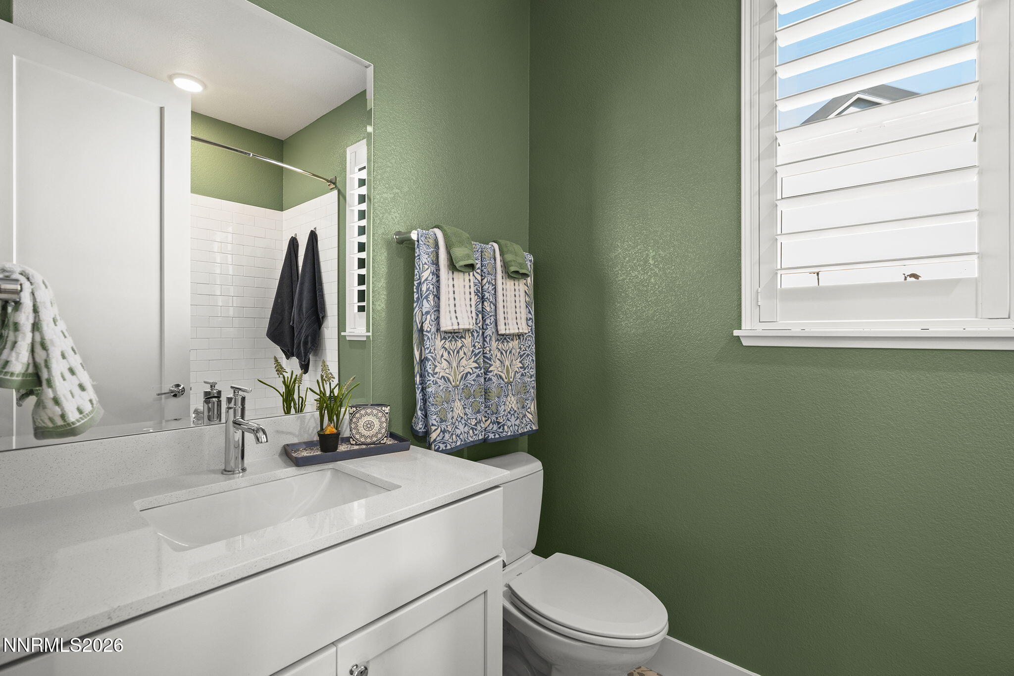 8726 Larkhaven Court Reno, NV 89523 - Photo 29 of 41 a bathroom with a sink a toilet and shower