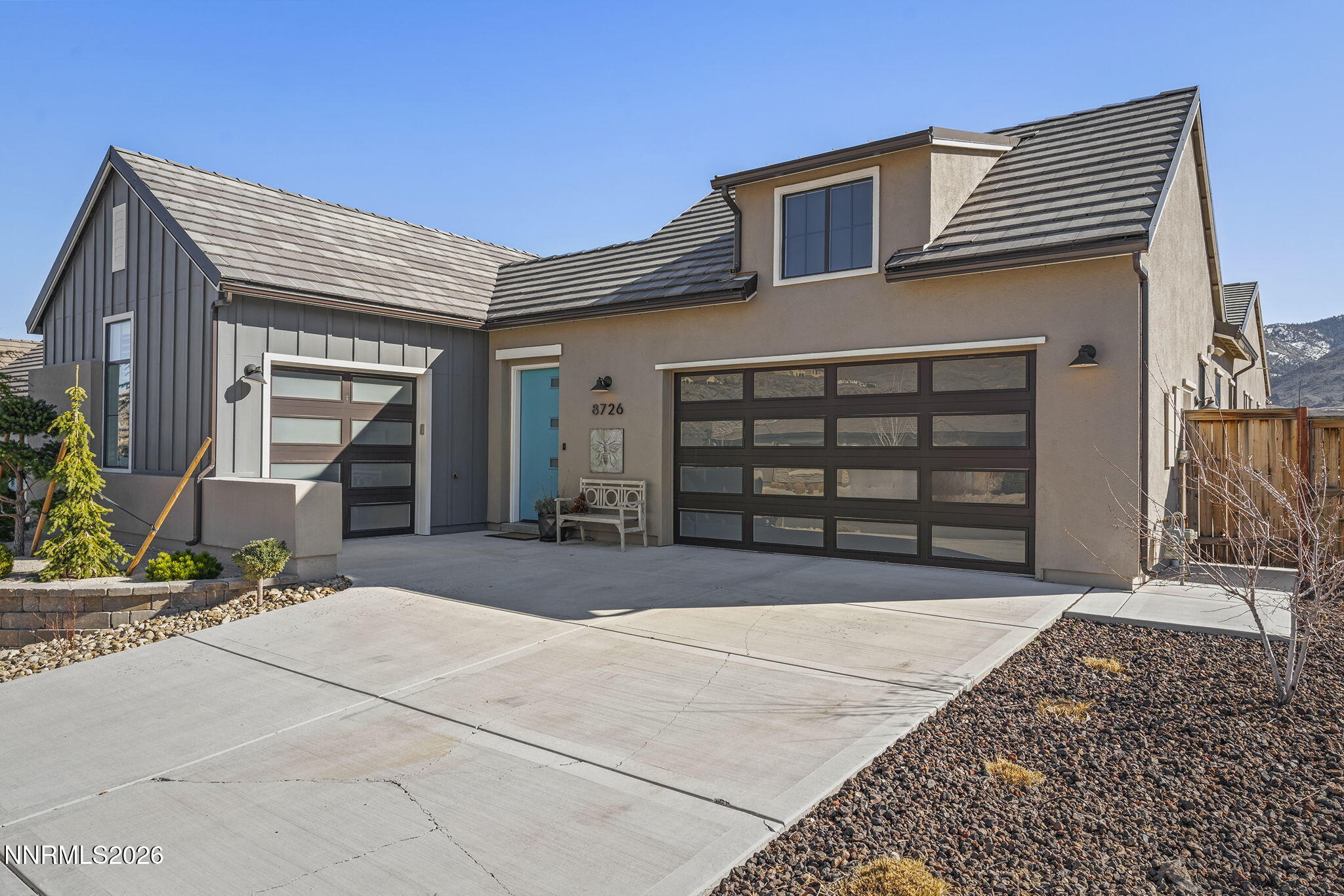 8726 Larkhaven Court Reno, NV 89523 - Photo 3 of 41 a front view of a house with a yard and garage