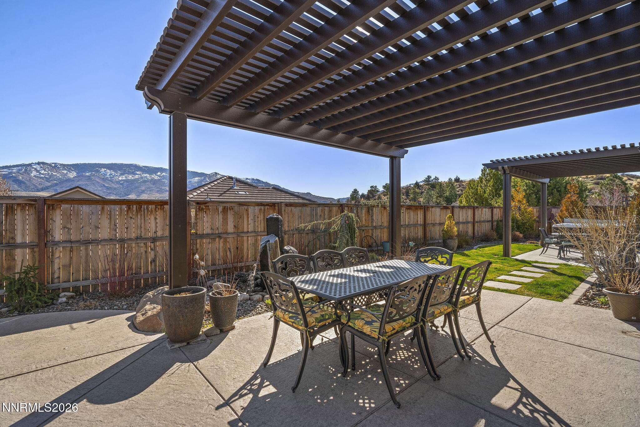 8726 Larkhaven Court Reno, NV 89523 - Photo 34 of 41 a patio with glass top table and chairs