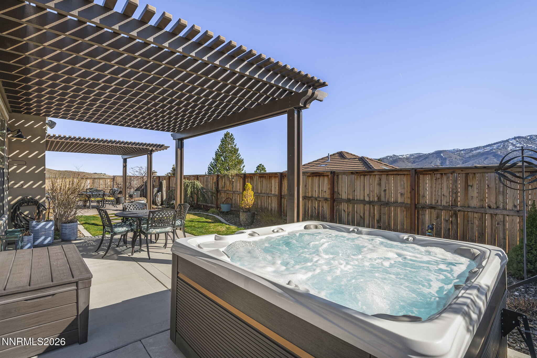 8726 Larkhaven Court Reno, NV 89523 - Photo 39 of 41 a view of patio with a table and chairs under an umbrella