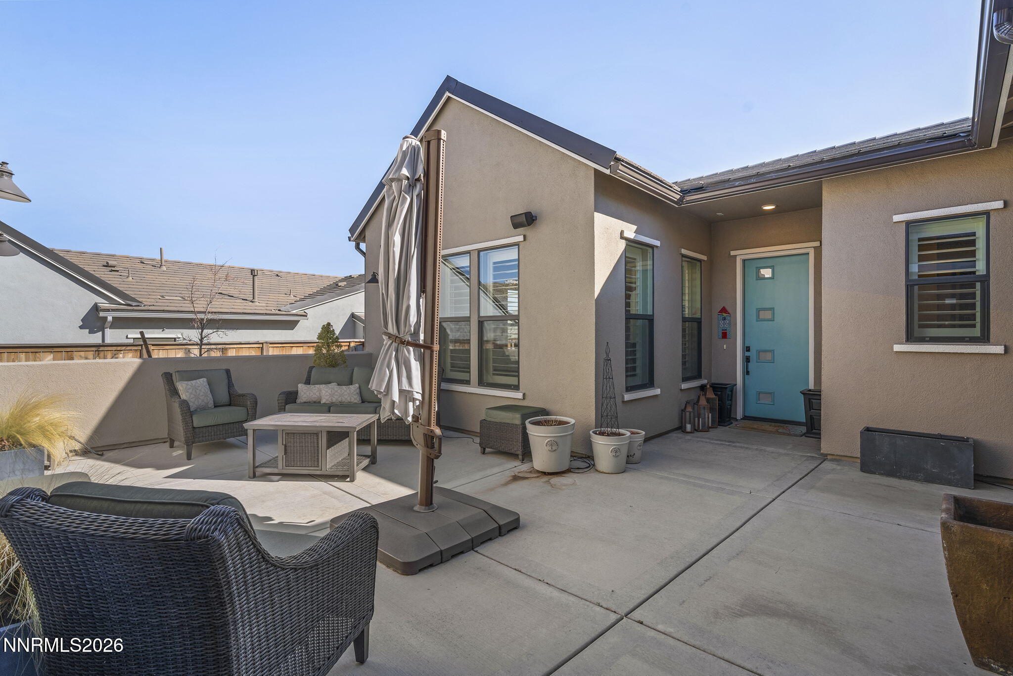 8726 Larkhaven Court Reno, NV 89523 - Photo 4 of 41 a view of a patio with couches chairs and potted plants