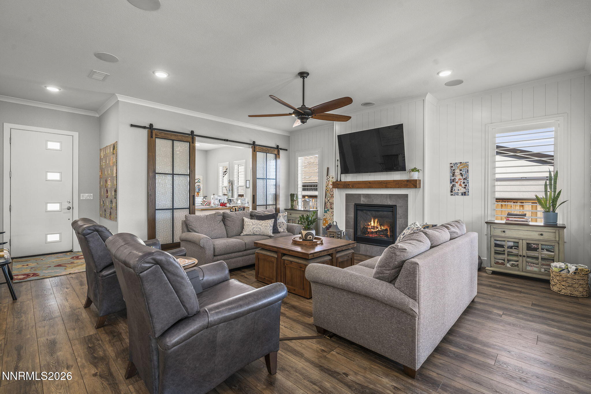 8726 Larkhaven Court Reno, NV 89523 - Photo 6 of 41 a living room with furniture fireplace and flat screen tv