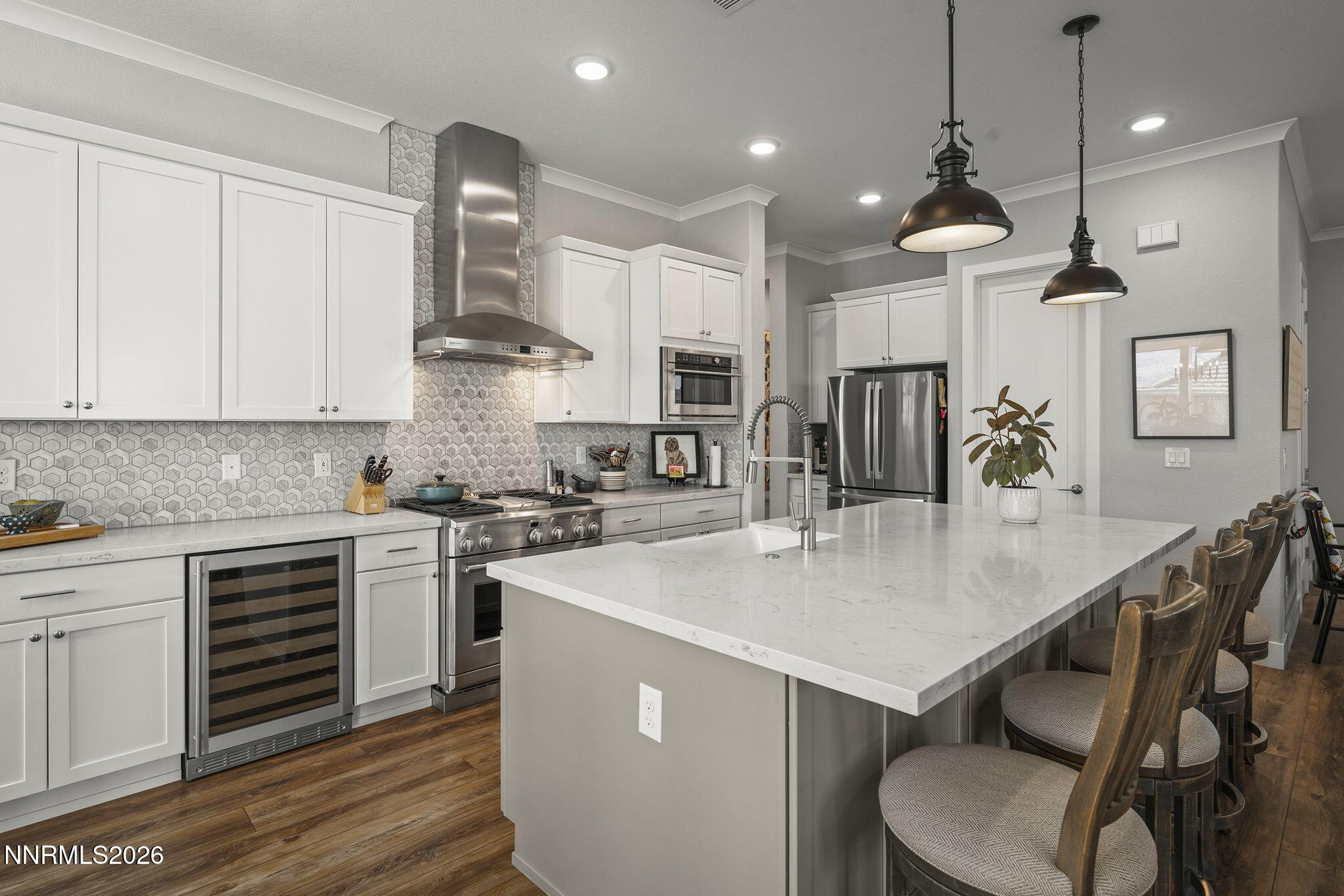 8726 Larkhaven Court Reno, NV 89523 - Photo 10 of 41 a kitchen with a table chairs stove and microwave