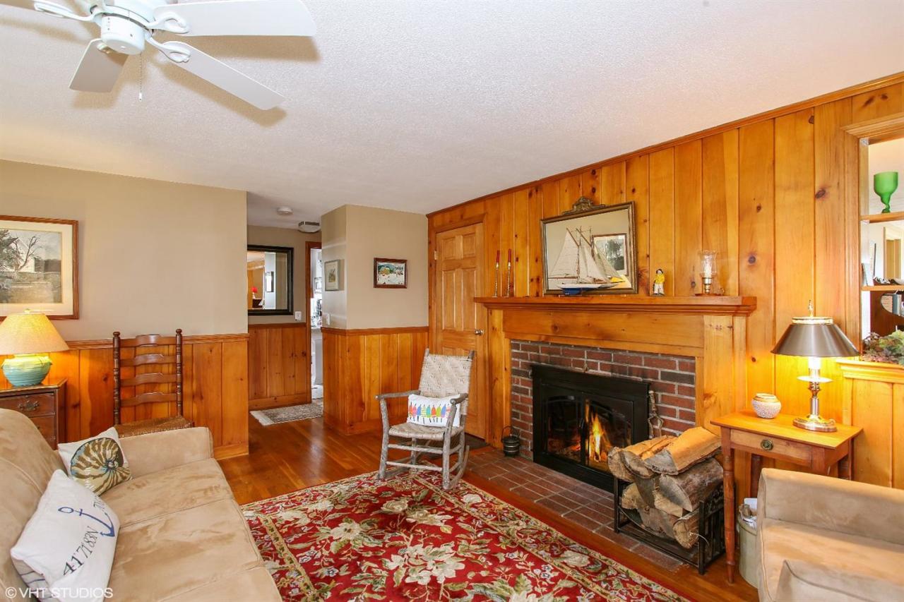 58 Rope Walk Road Bourne, MA 02532 - Photo 4 of 20 a living room with furniture a rug and a fireplace