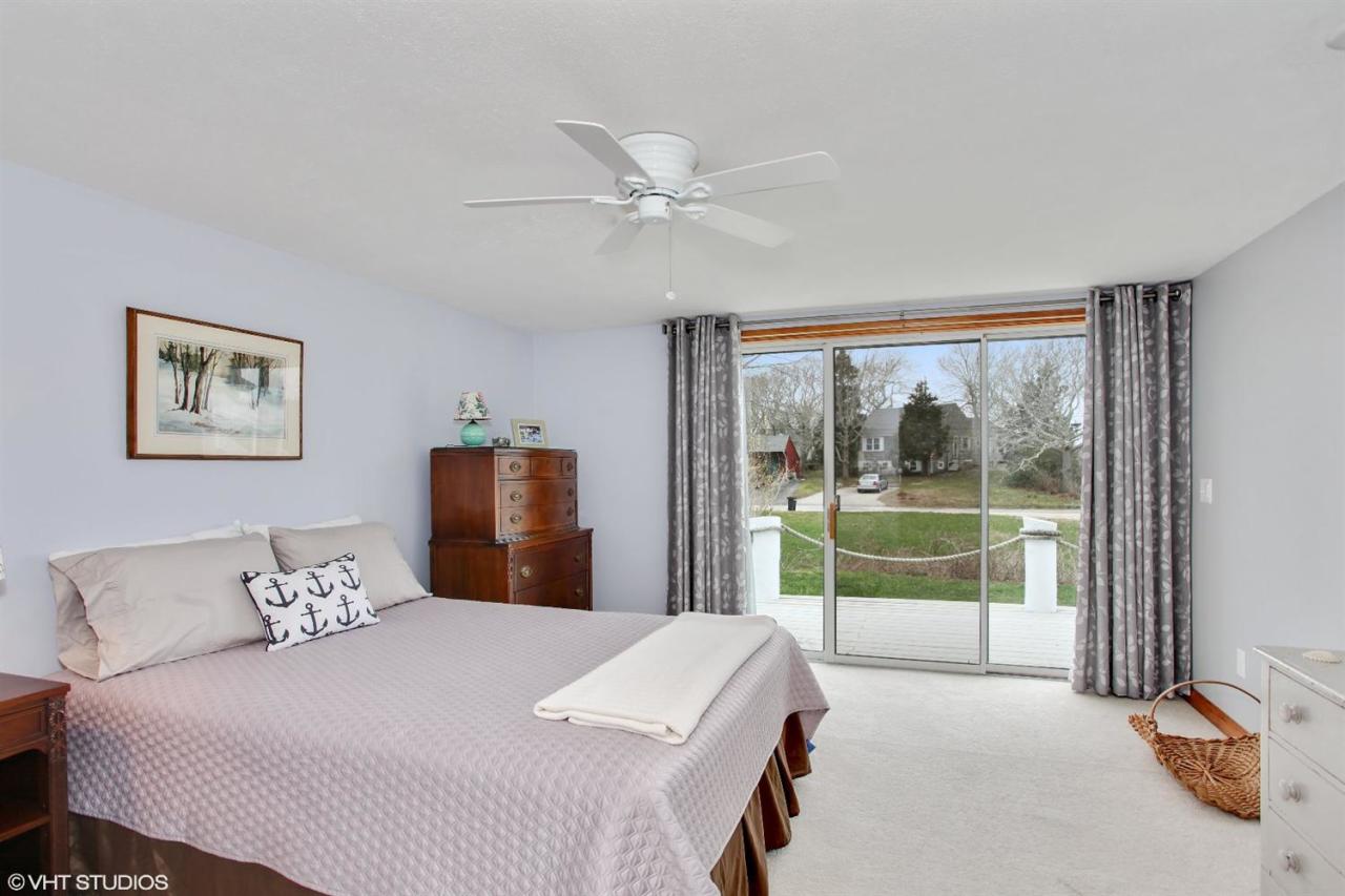 58 Rope Walk Road Bourne, MA 02532 - Photo 10 of 20 a bedroom with a large bed and a large window