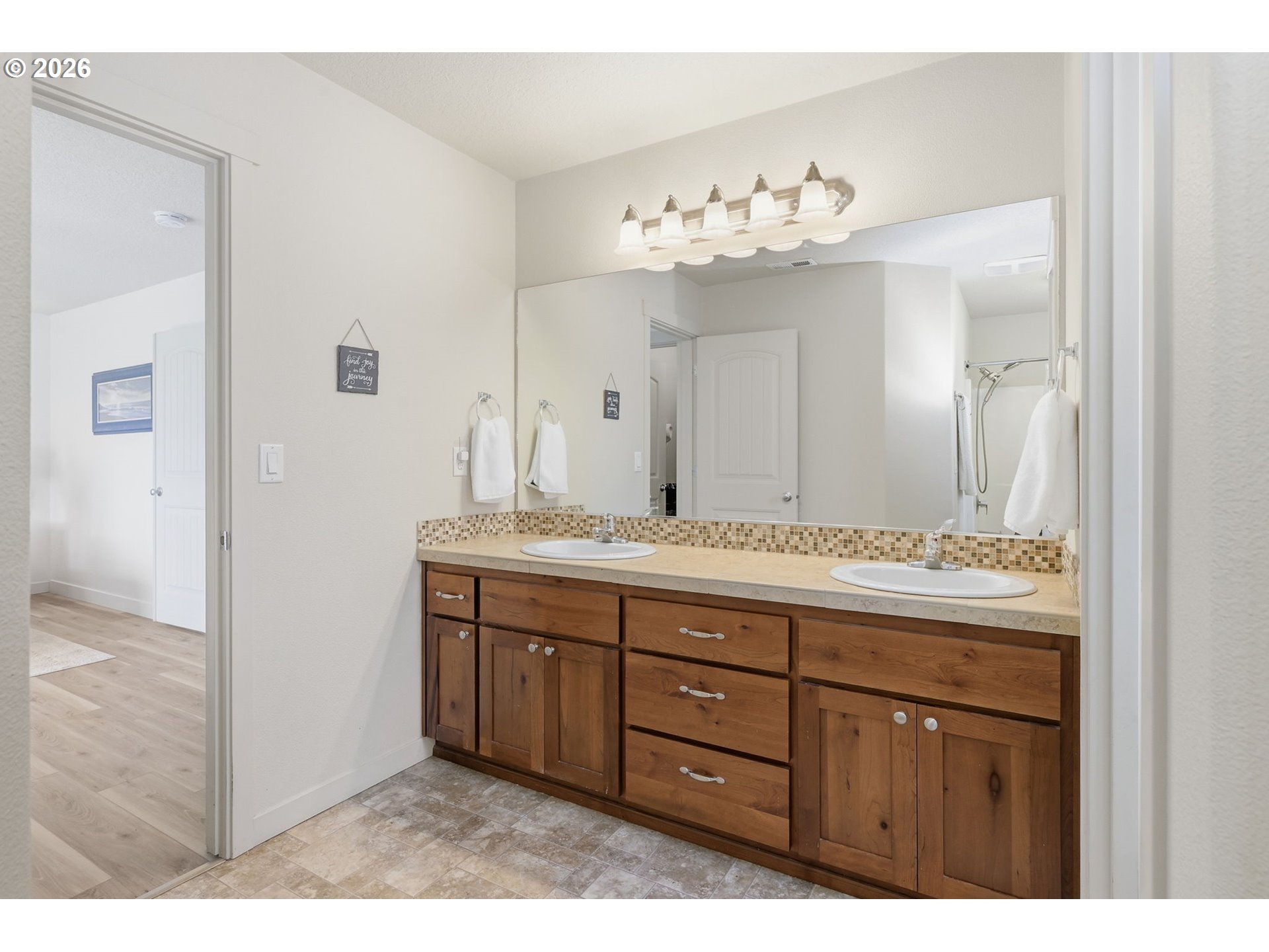 5442 Pranz Place Eugene, OR 97402 - Photo 16 of 34 a bathroom with a sink vanity and a mirror
