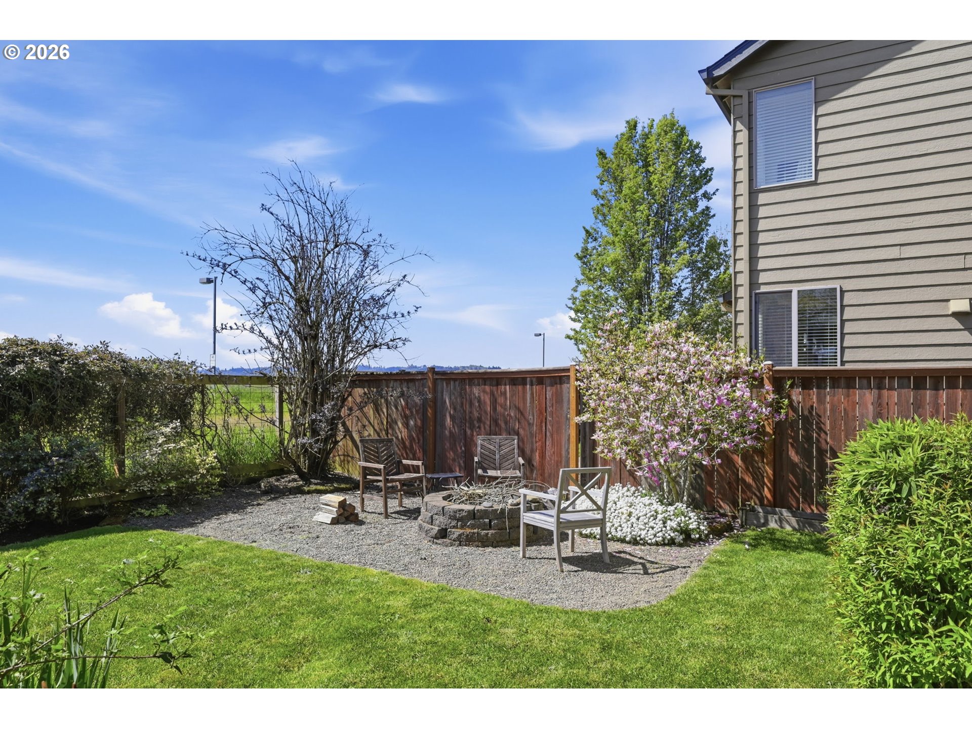 5442 Pranz Place Eugene, OR 97402 - Photo 22 of 34 a view of a backyard with sitting area
