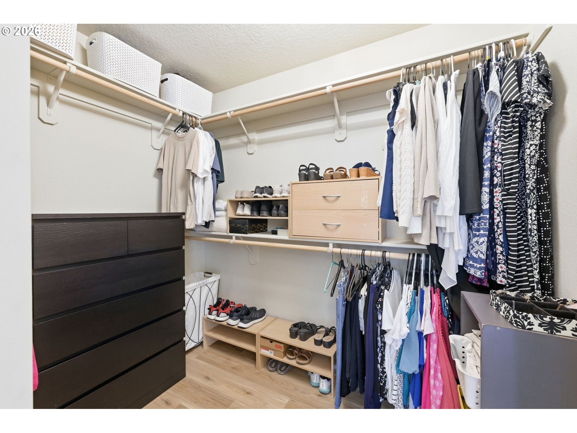 5442 Pranz Place Eugene, OR 97402 - Photo 32 of 34 a view of walk in closet with clothes and shoes