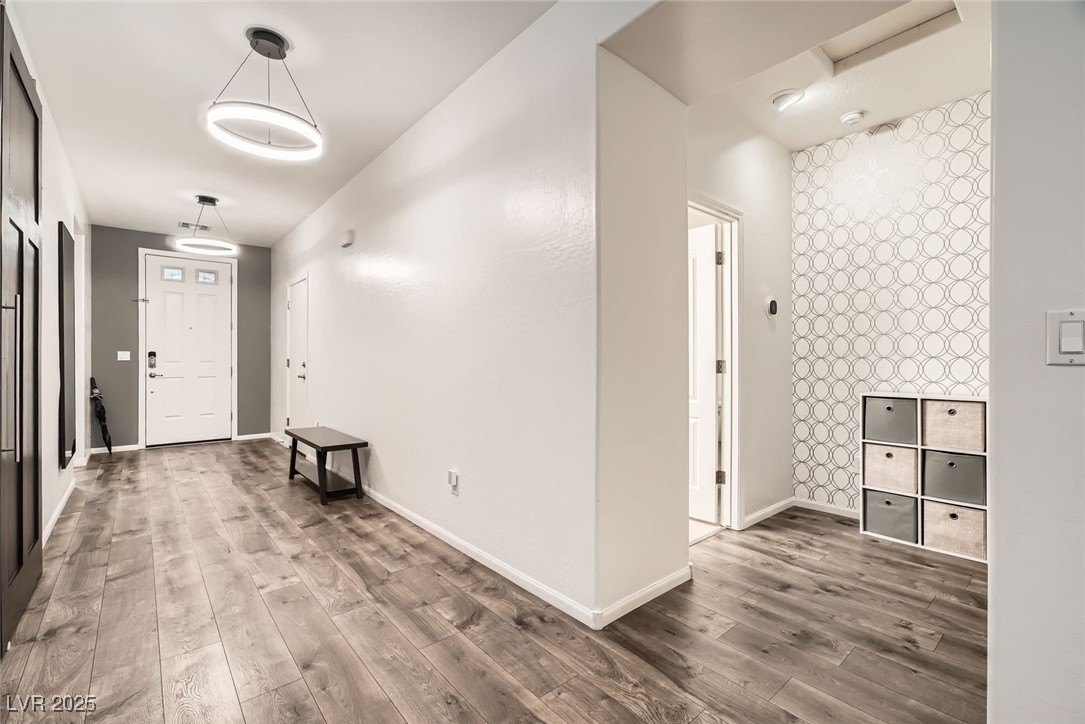 6233 Canterbury Field Road Las Vegas, NV 89113 - Photo 3 of 25 Foyer with wood finished floors and baseboards