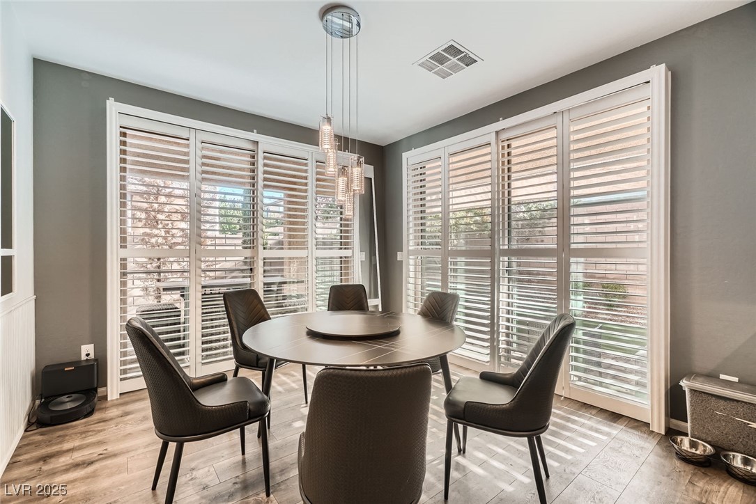 6233 Canterbury Field Road Las Vegas, NV 89113 - Photo 8 of 25 Dining space with light wood finished floors