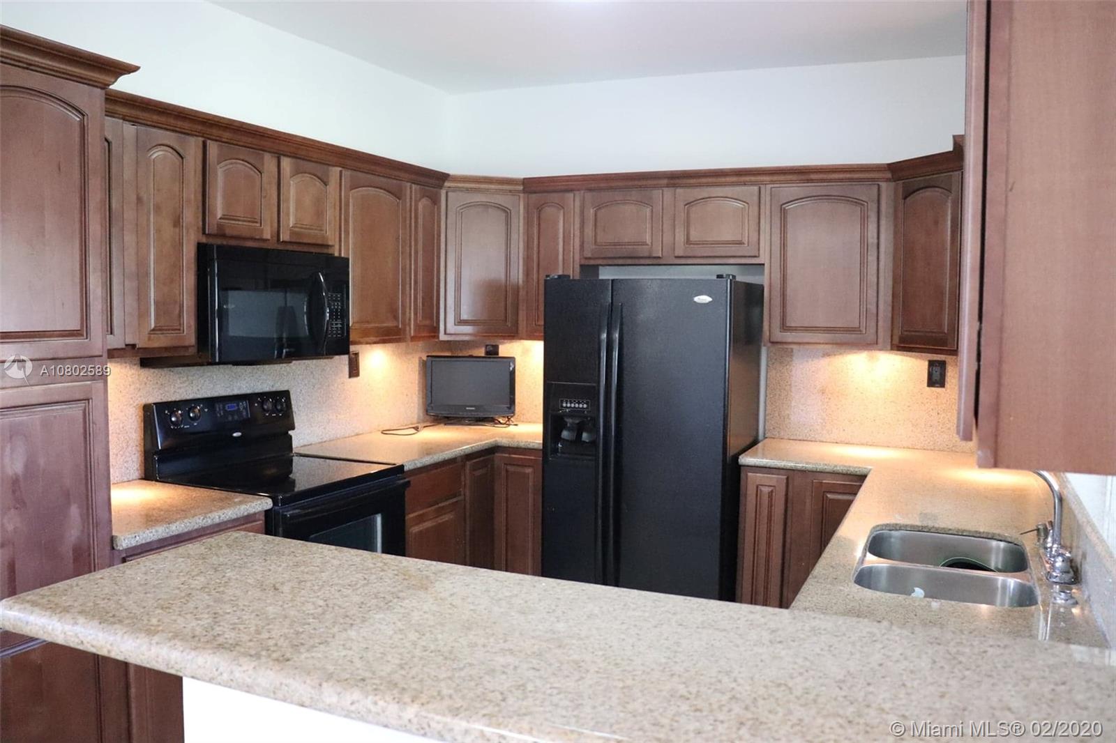 9490 Independence Road Cutler Bay, FL 33157 - Photo 3 of 44 Nice kitchen, granite counter tops, wood cabinets, double sink.
