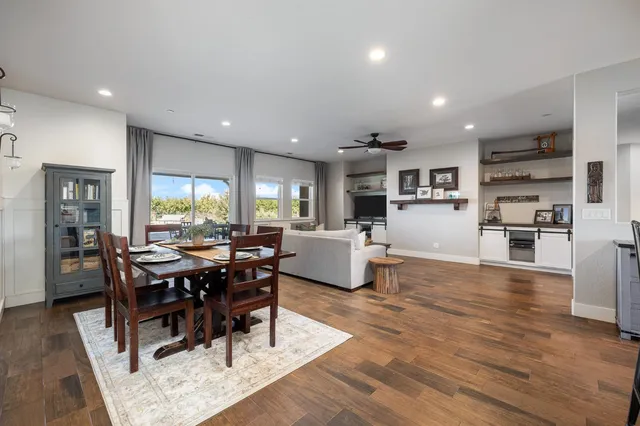 a kitchen with a sink stainless steel appliances and white cabinets