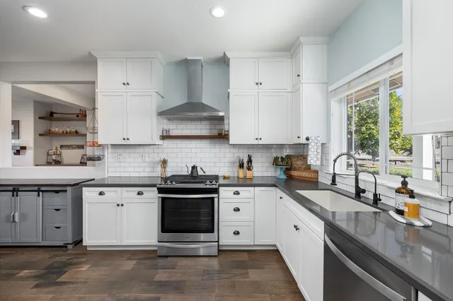 a bedroom with a large bed and a ceiling fan