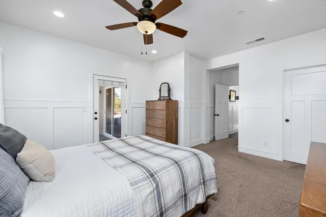 a bedroom with bed and window