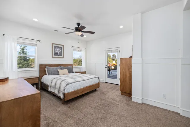 a white tub sitting next to a white sink