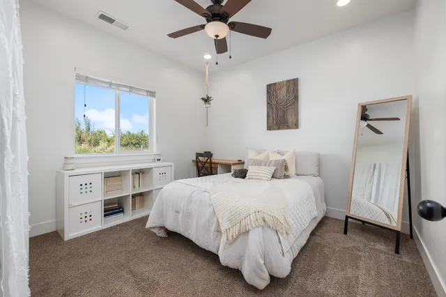 an aerial view of a house with swimming pool