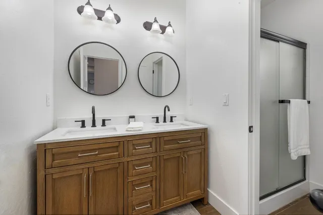 a view of a patio with a table and chairs