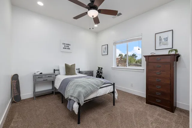 a view of a patio with a table chairs and a backyard