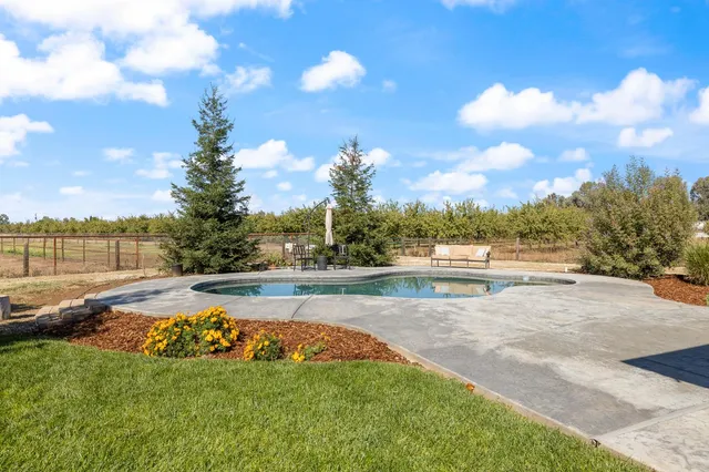 a view of swimming pool with a couch