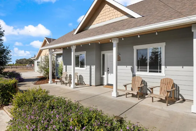 an aerial view of a house with a swimming pool