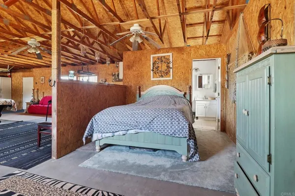 a view of a room with wooden walls