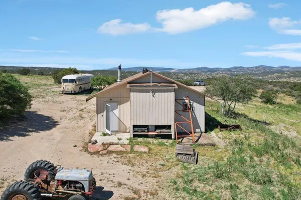 a view of roof with small yard