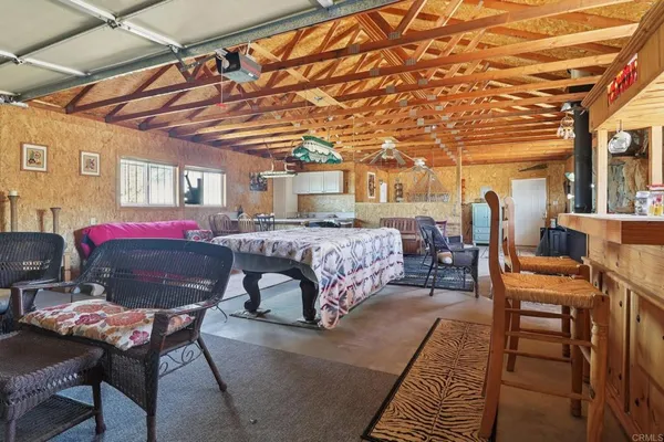 a bedroom with furniture and a bathtub