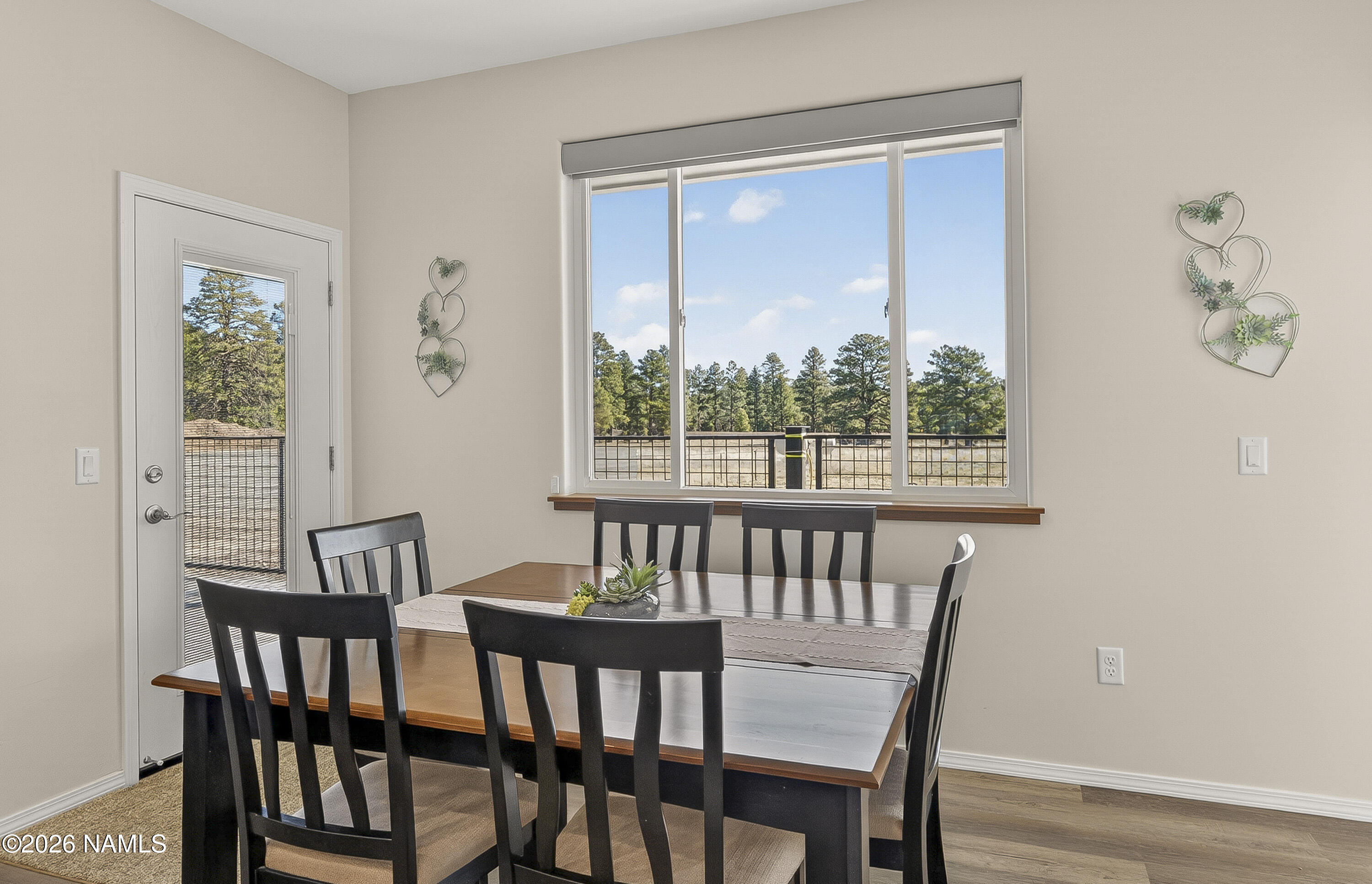 6560 Johnson Ranch Road Flagstaff, AZ 86004 - Photo 15 of 57 a view of a dining room with furniture window and outside view