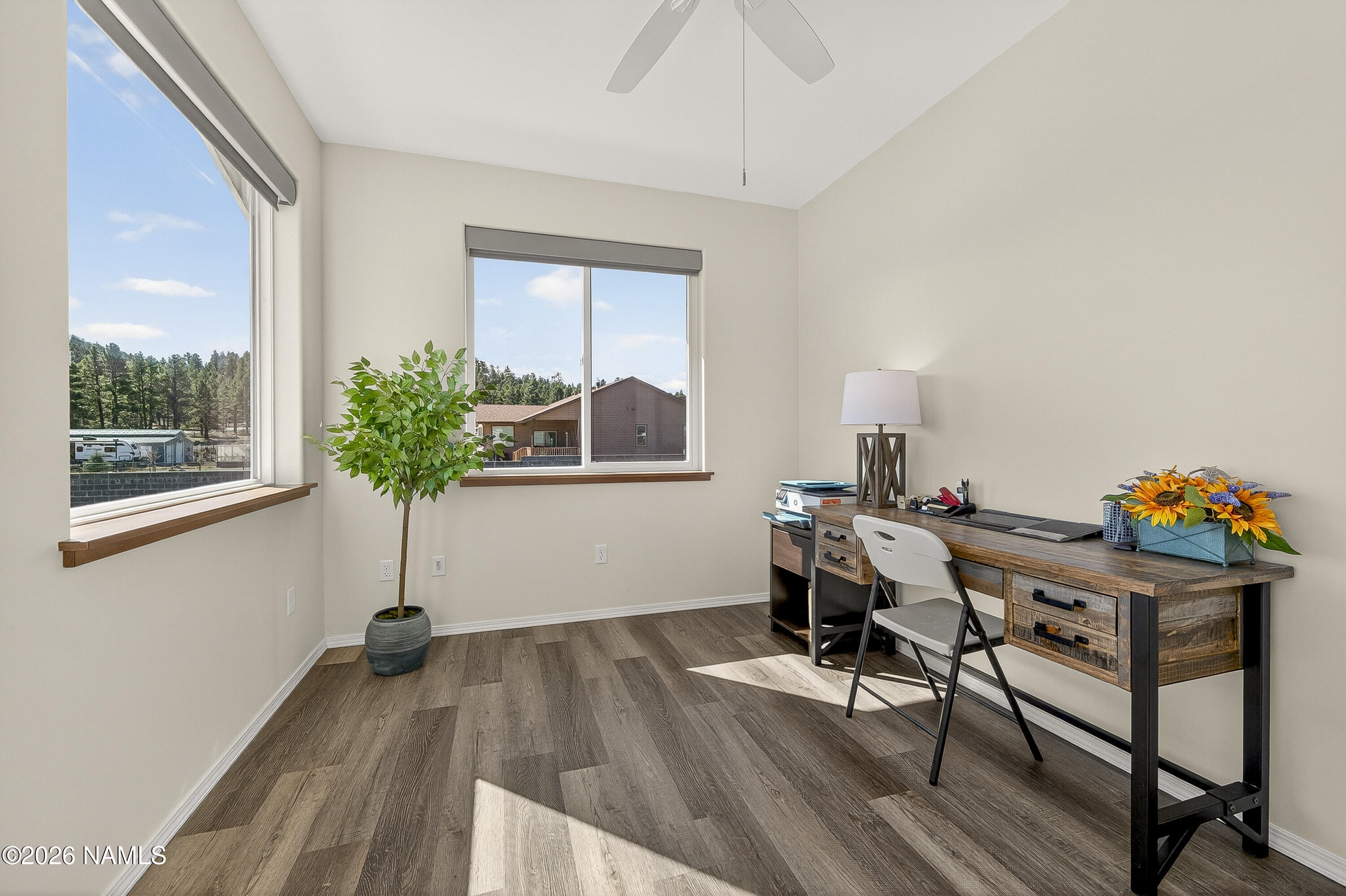 6560 Johnson Ranch Road Flagstaff, AZ 86004 - Photo 17 of 57 a view of a workspace with furniture and a potted plant