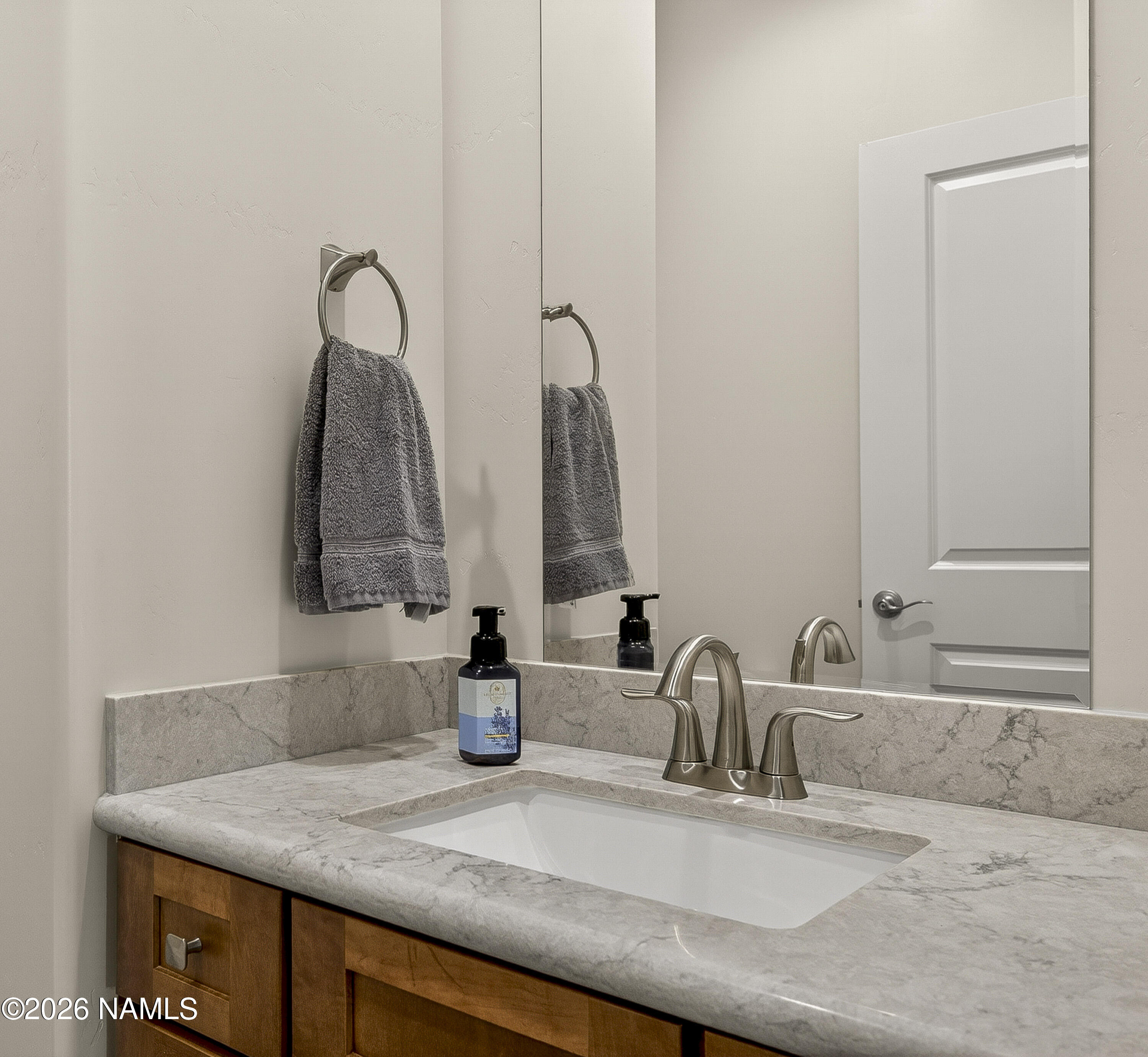 6560 Johnson Ranch Road Flagstaff, AZ 86004 - Photo 18 of 57 a bathroom with a sink and a mirror