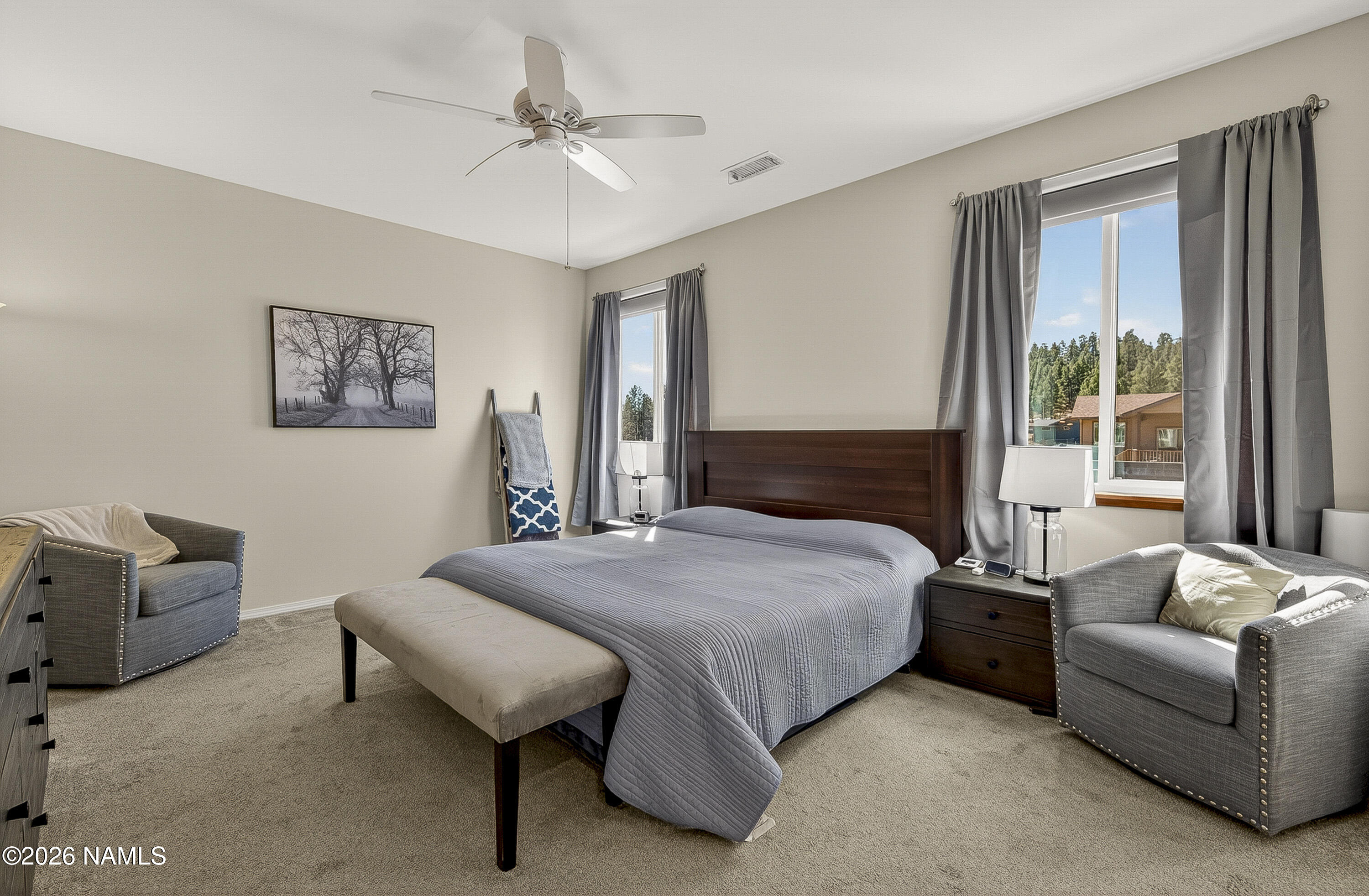 6560 Johnson Ranch Road Flagstaff, AZ 86004 - Photo 19 of 57 a bedroom with a bed and a couch