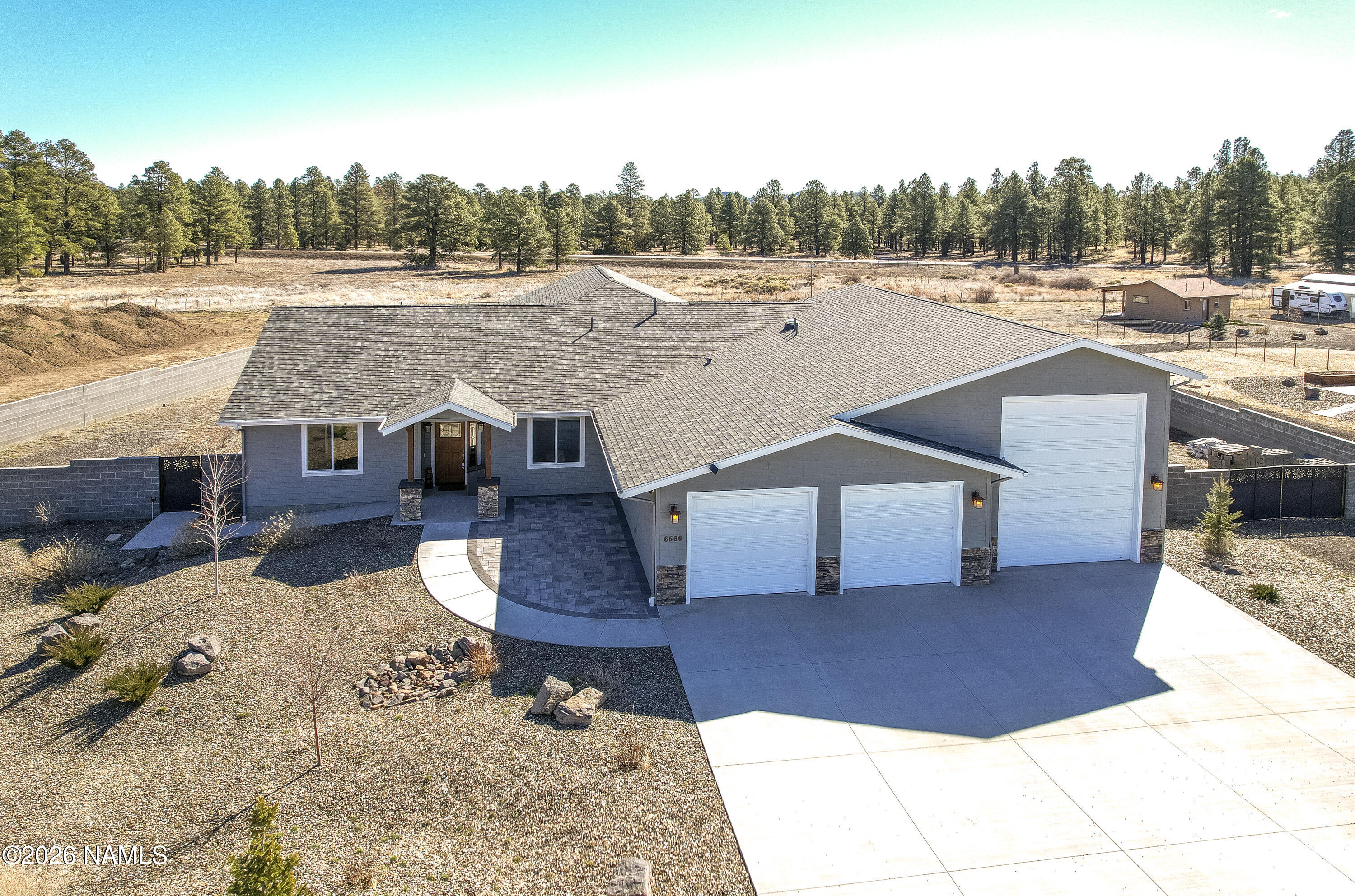 6560 Johnson Ranch Road Flagstaff, AZ 86004 - Photo 2 of 57 a view of house with a yard
